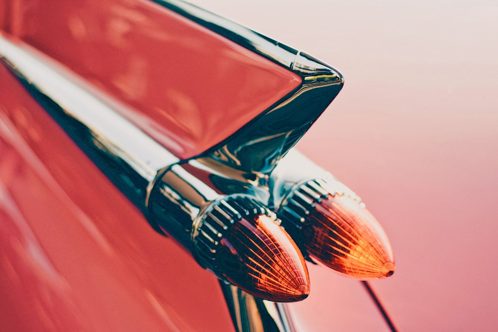 Close-up of a glossy red tail fin catching the light